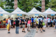 Pop up tents and people blurred in background