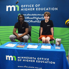 Student workers at the Office of Higher Education Minnesota State Fair booth, taken August 2022