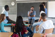 Teacher speaking with high school students