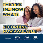 Two individuals looking at a laptop on a table. 