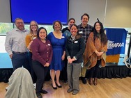 Group of people posing for the camera.