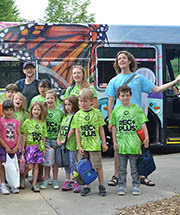 Kids in front of Nature Connector bus