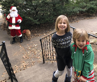 Santa surprises two Saint Paul kids with a visit.
