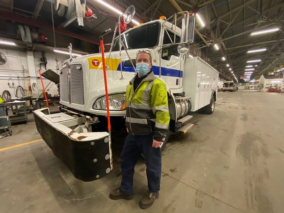 Mechanic Technician Dan Aasen with a tow truck.