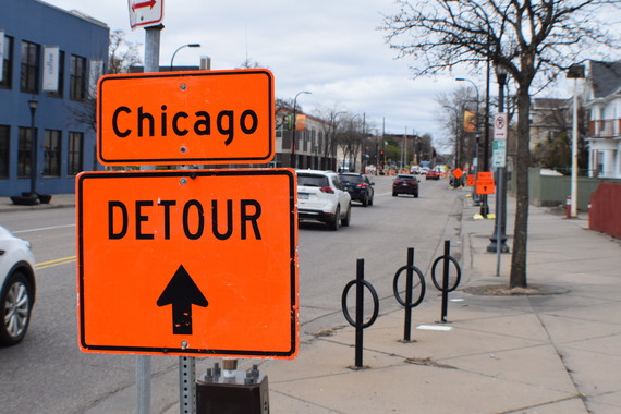 A sign showing a construction detour route for Chicago Avenue