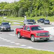 Truck and cars at roundabout