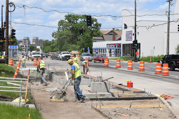 crews completing concrete work at the intersection of Chicago and 24th in South Minneapolis