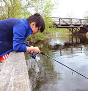 Boy fishing in Phalen-Keller Regional Park