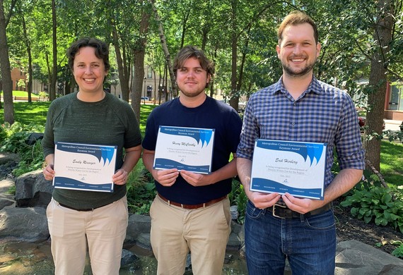Emily Resseger, Henry McCarthy, and Erik Herberg stand in Mears Park with their Keystone award.