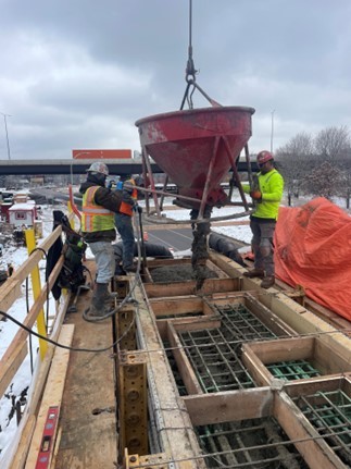 Photo: Crews pour concrete for the Etna Street bridge.