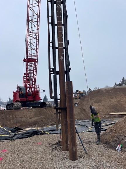 Photo: Pile driving for bridge construction continues near Etna Street.