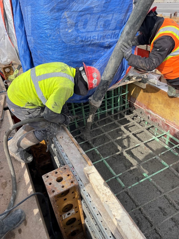 Photo: Crews pour concrete for a bridge foundation in Woodbury. 