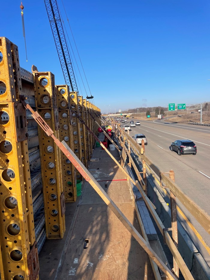 Crews bracing bridge foundation