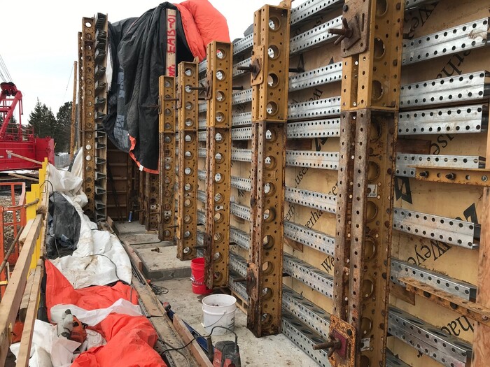 Photo: Crews set forms for the east bridge abutment near Etna Street.  