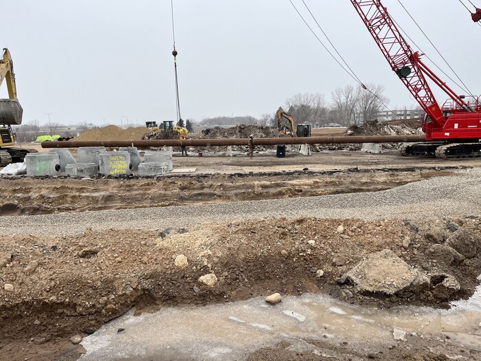 Photo: Crews weld pipes together for sanitary sewer installation in Oakdale.