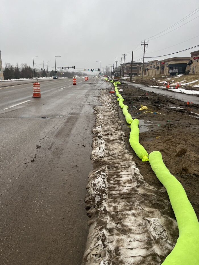 Photo of Crews install erosion control barriers along Bielenberg Drive in Woodbury. 