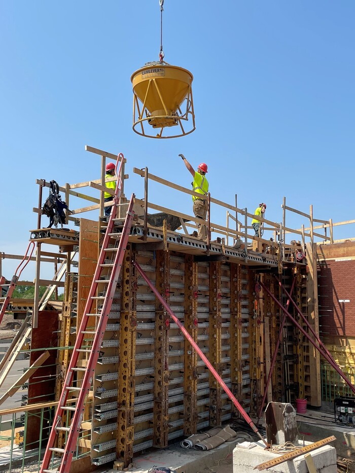 Crews pour concrete into forms at the north Bielenberg bridge abutment in Oakdale. 