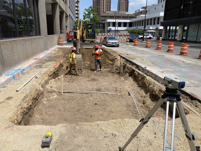 Crews excavate the sidewalk area on 6th Street in Downtown St. Paul. 