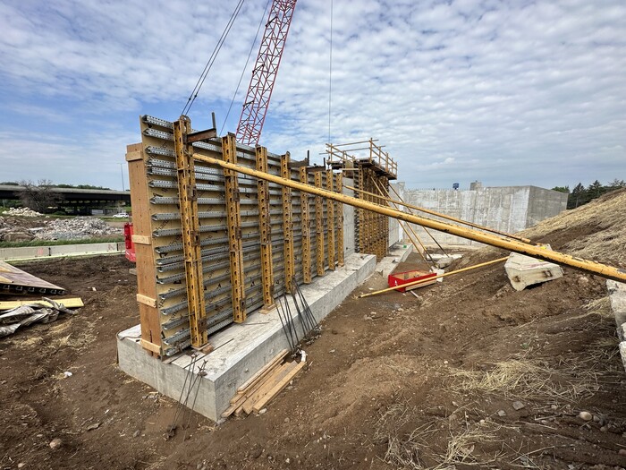 Crews construct a retaining wall near Etna Street in East St. Paul. 