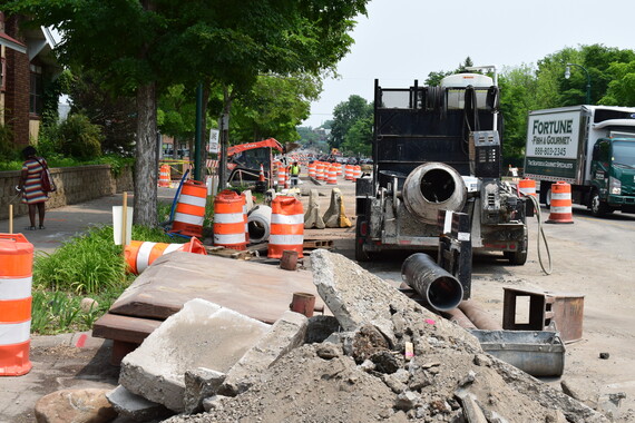 A machine sits near a pile of removed concrete on Lake Street