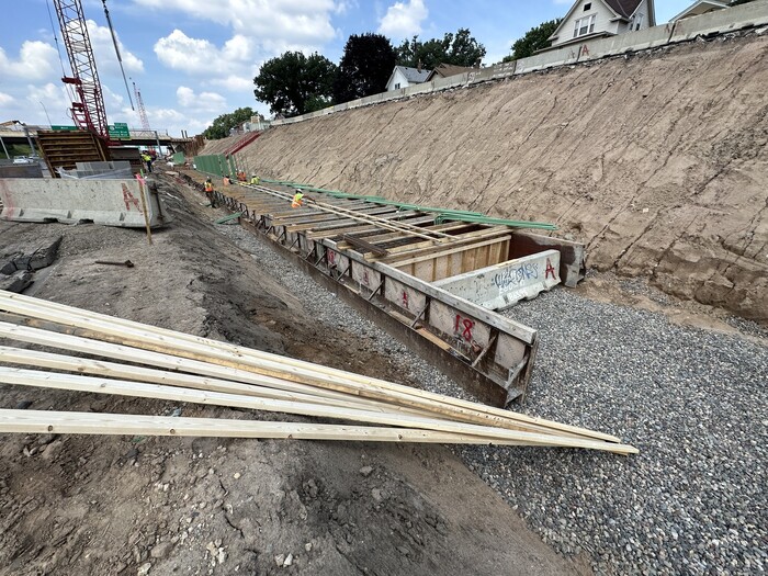 Crews build retaining wall foundations near Earl Street in east St. Paul. 
