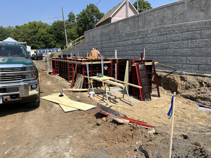 Crews construct a retaining wall exteriors near Mounds Boulevard in St. Paul