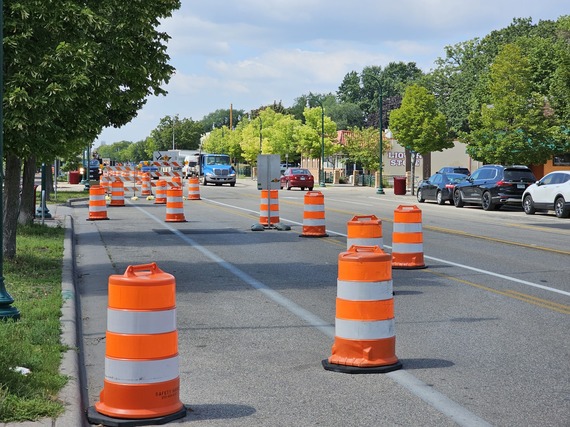 An image of construction barrels marking off the right lane of eastbound traffic on Lake Street
