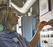 Plant operator checks control panel