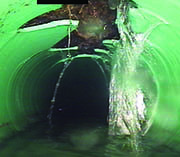 Water leaks into broken pipe