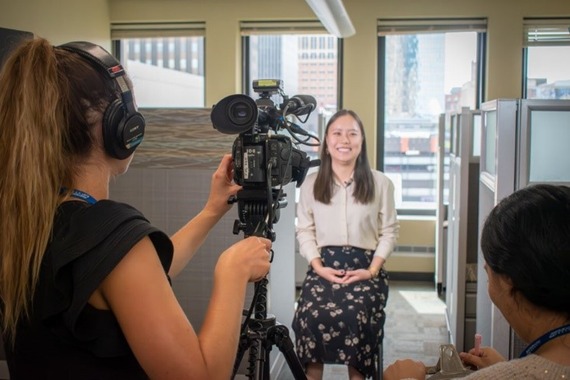 Communications intern and HR intern film the new promotional video for the Met Council intern program