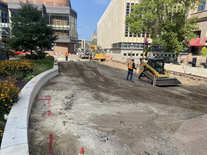 Crews grade roadway near Rice Park BRT station platform