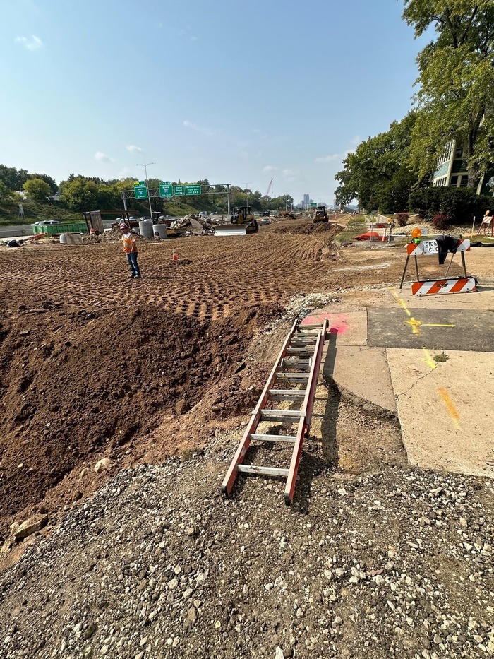 Crews grade Hudson Road in East St. Paul