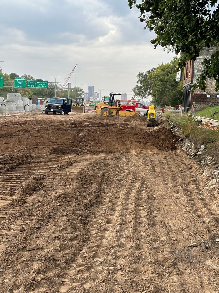 Crews backfill Hudson Road following utility installations in East St. Paul