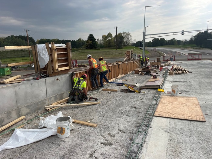 Crews install forms for railings on the new Bielenberg Drive bridge in Woodbury