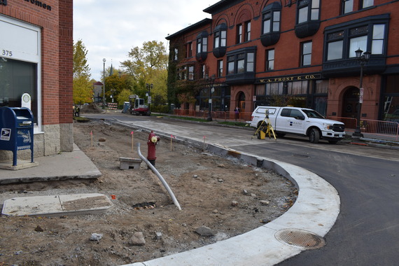An image of the NE corner of Selby & Western, showing concrete curbs being put in place and shelter area prepped