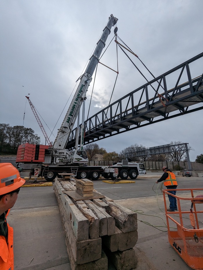 Crews place Maple Street pedestrian bridge over Interstate 94 in East St. Paul