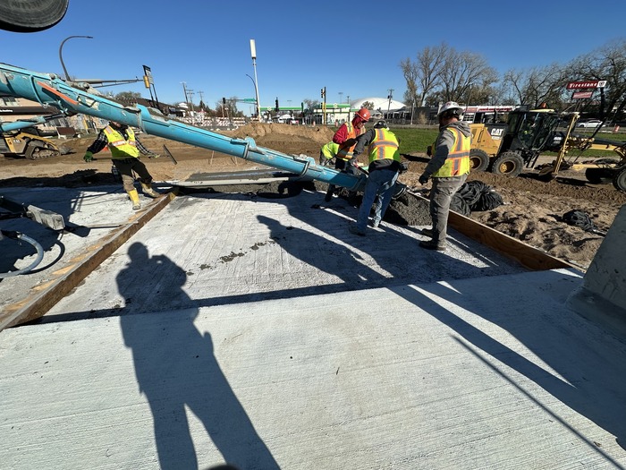 Crews pour concrete at Ruth Street in East St. Paul