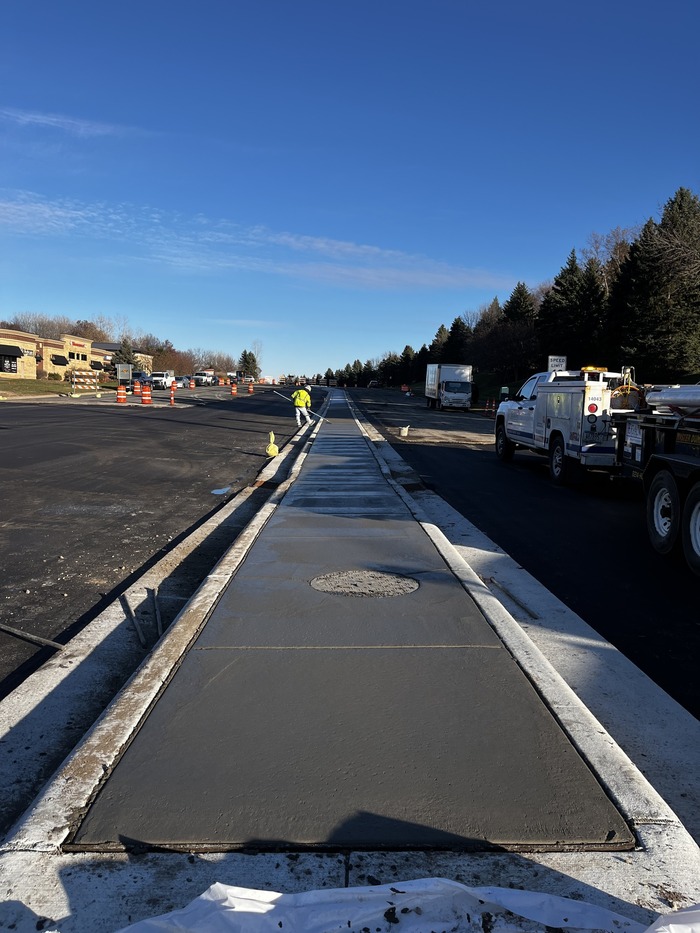 Crews pour concrete for Bielenberg Drive medians in Woodbury