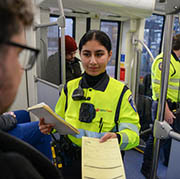 Community service officer issues a citation to a rider.