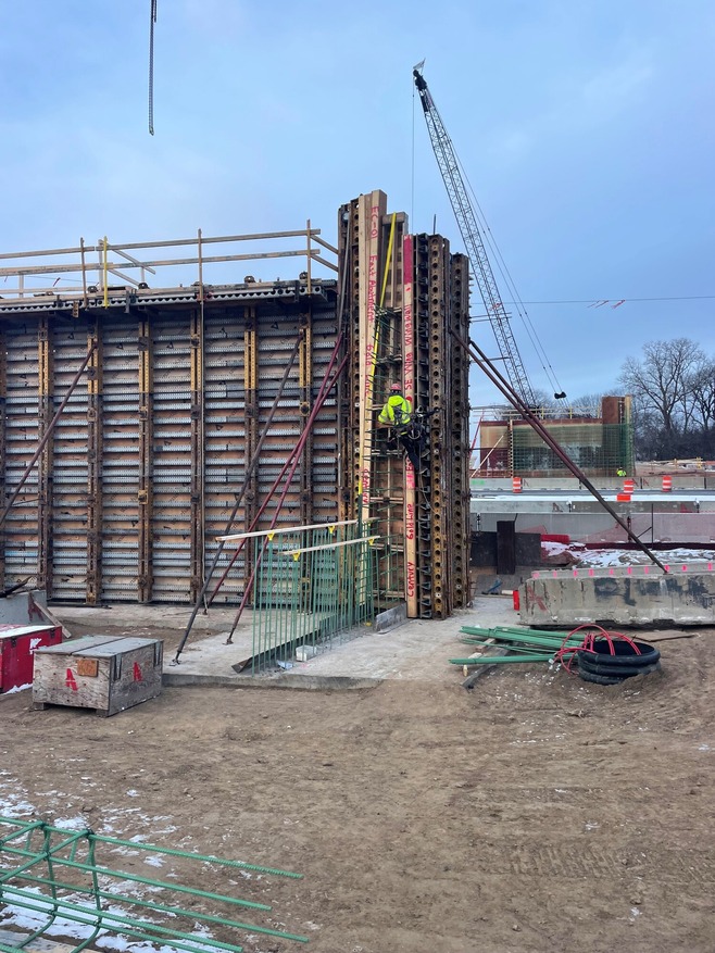 Crews tighten form ties on the east side bridge foundation at Century Avenue/Hwy 120 in Maplewood