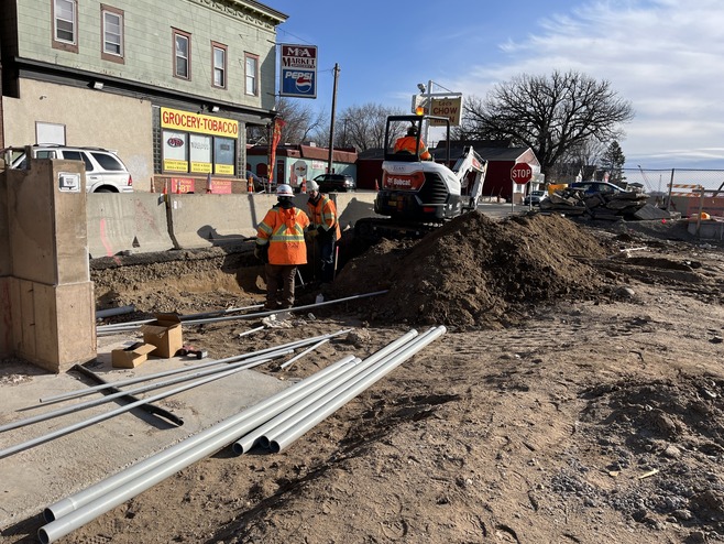 Crews install conduit at the Earl Station in east St. Paul
