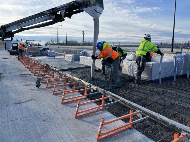 Crews pour concrete for the Mounds Station area
