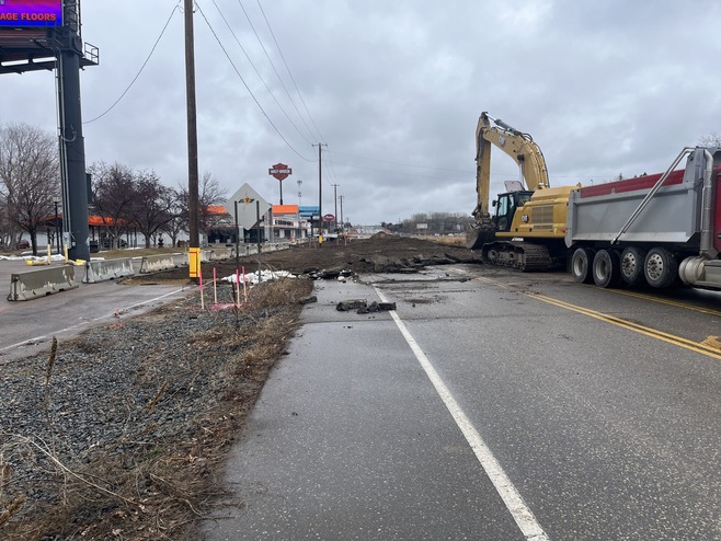 Crews remove pavement on Hudson Boulevard in Oakdale