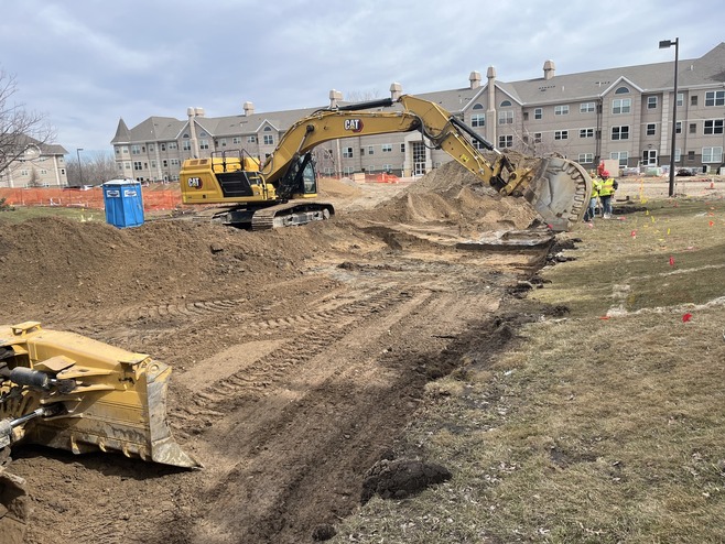 Crews grade near Guider Drive for the Queens Drive station