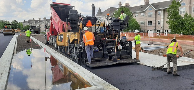 Crews pave Guider Drive in Woodbury