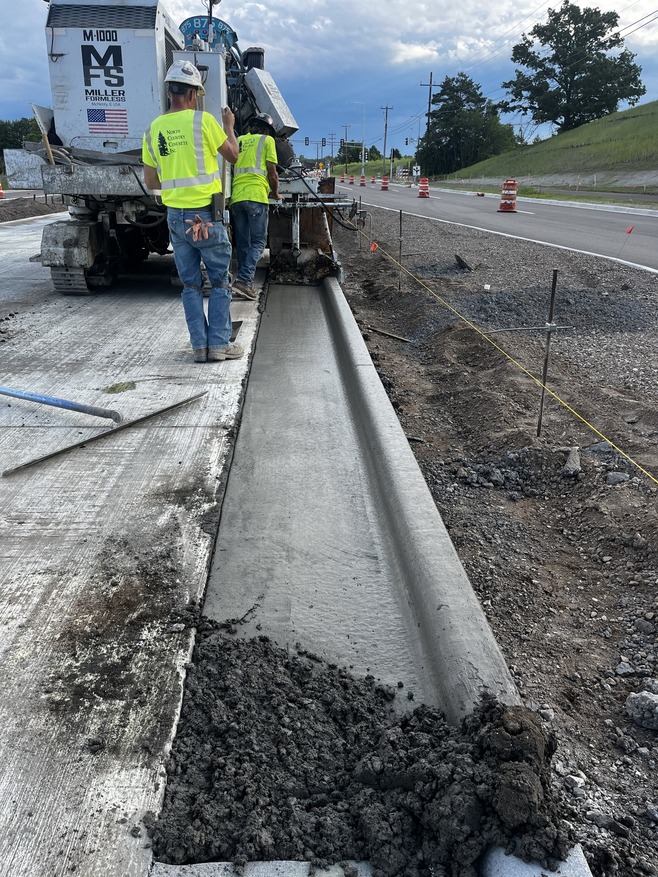 Crews install curbs along Bielenberg Drive in Woodbury
