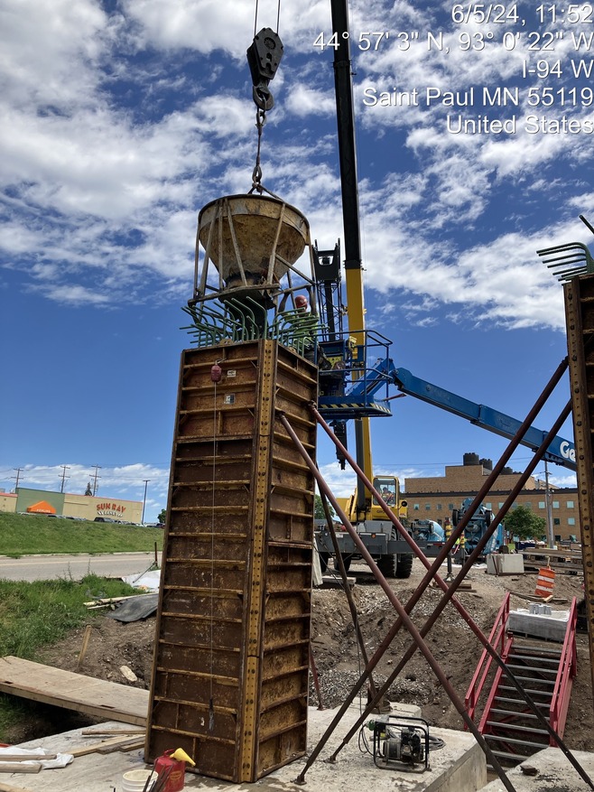Crews construct bridge piers for the pedestrian bridge over McKnight Road