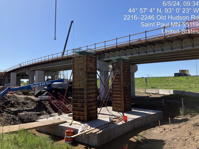 Crews construct bridge piers for the pedestrian bridge over McKnight Road