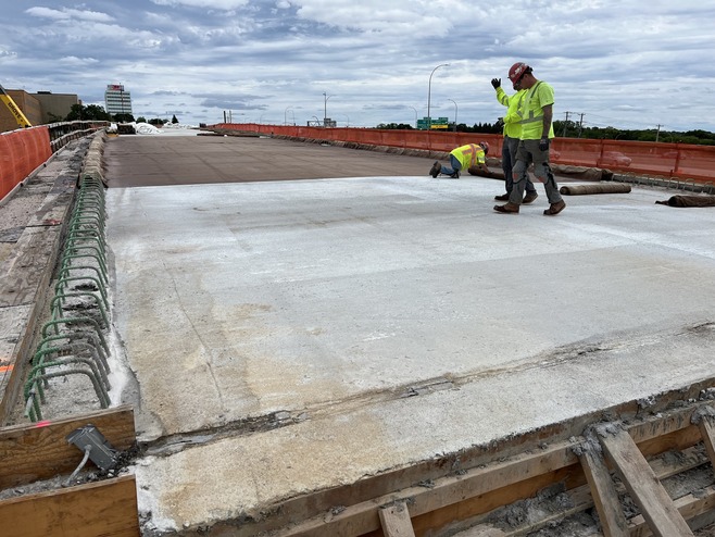 Crews construct the bus-only bridge over McKnight Road