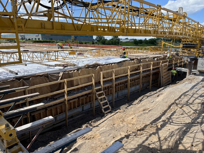 Crews pour concrete for the 4th Street bridge over I-694. 